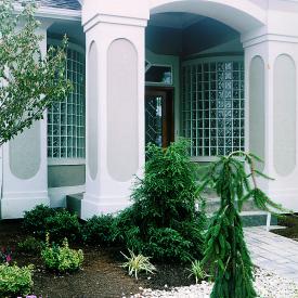 Curved sidelights provide light and make a welcoming first impression.  