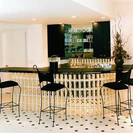 Build a bar that seems to float on a curtain of light. Glass block's flexibility lets you design curves, corners and undulating